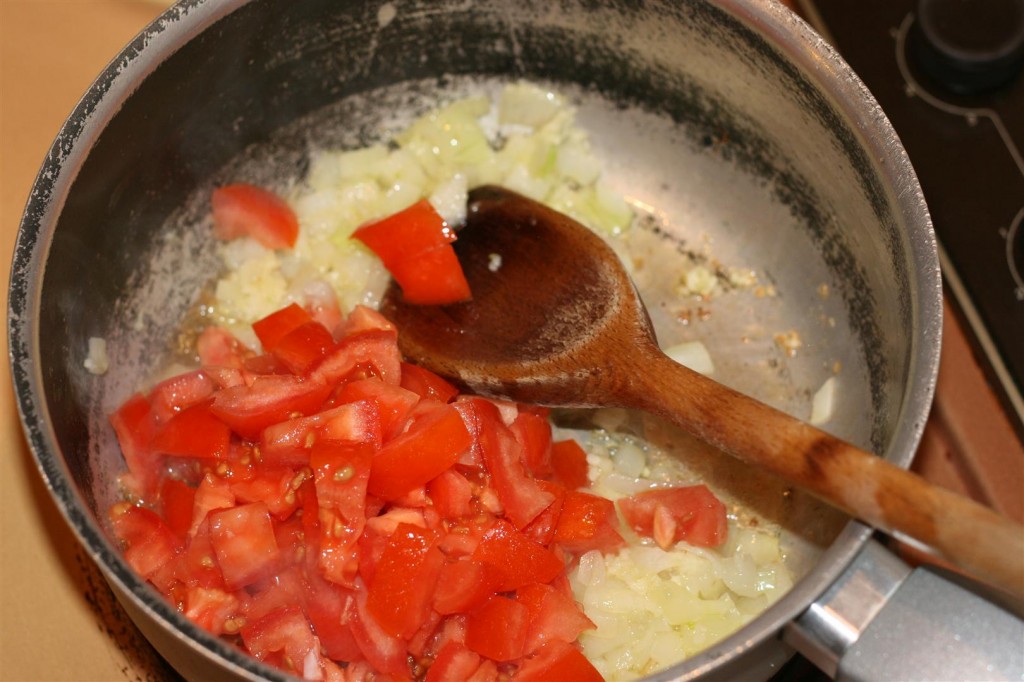 Cooking the onion and tomato