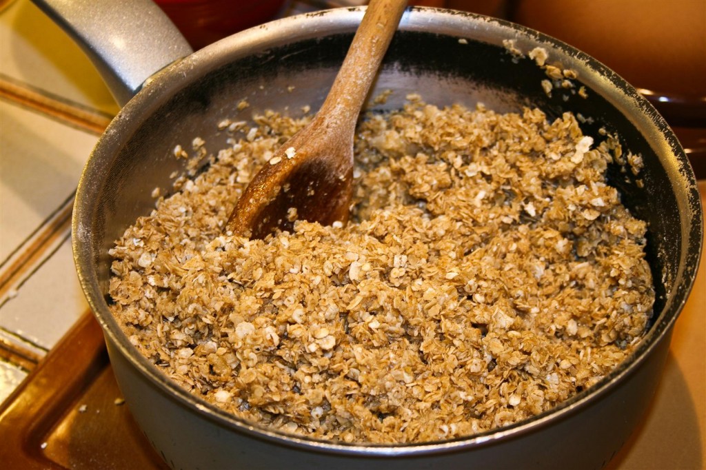 Mixing the oats in with the sugar and butter