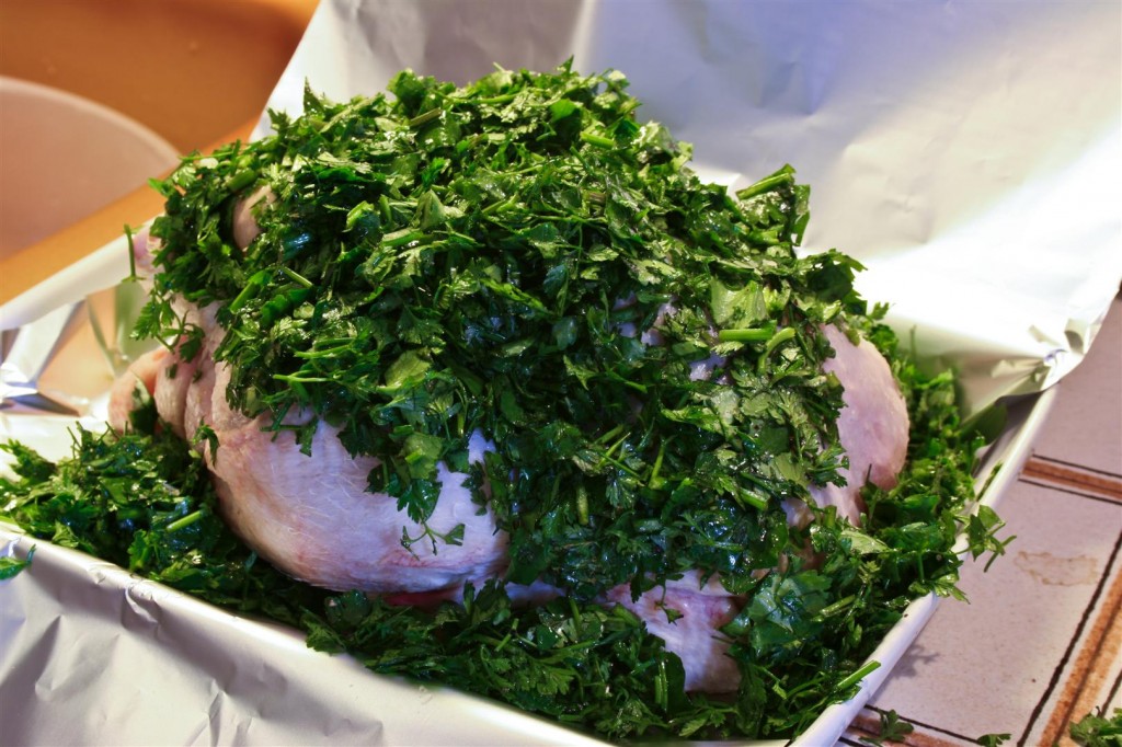 Covering the chicken with the herbs