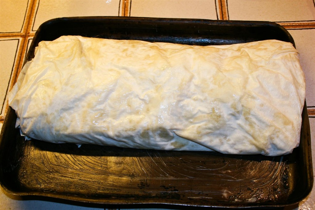 Brushing the strudel with butter for the oven