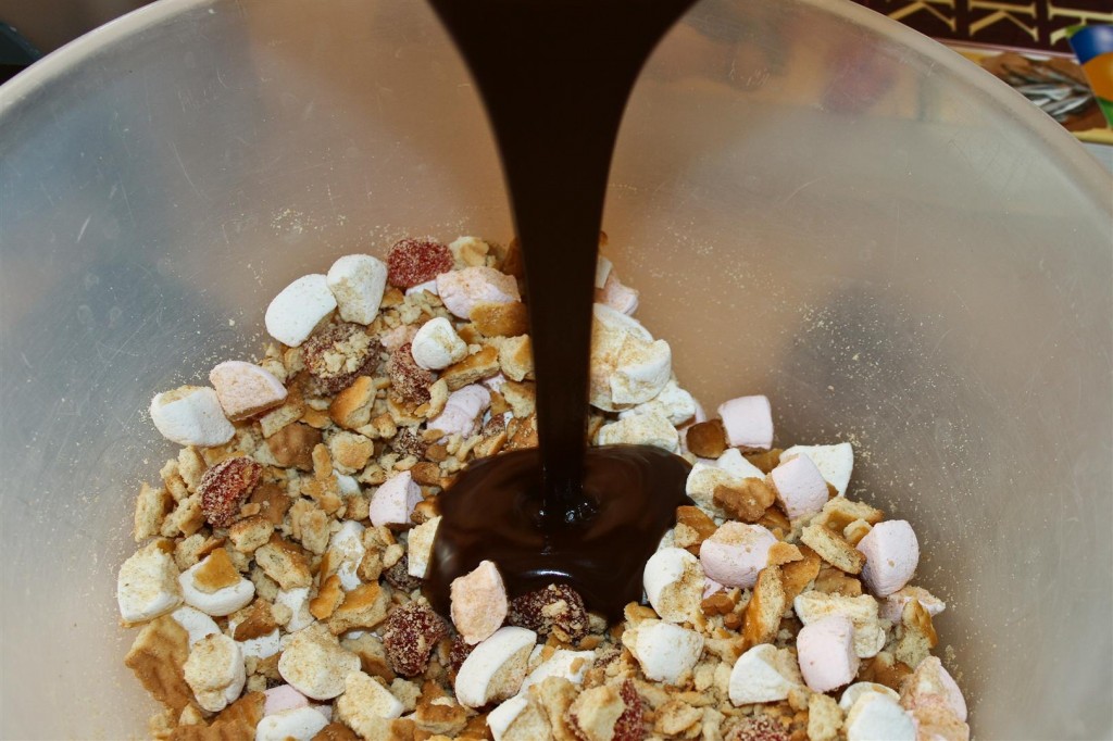 Mixing the chocolate with the biscuit mix