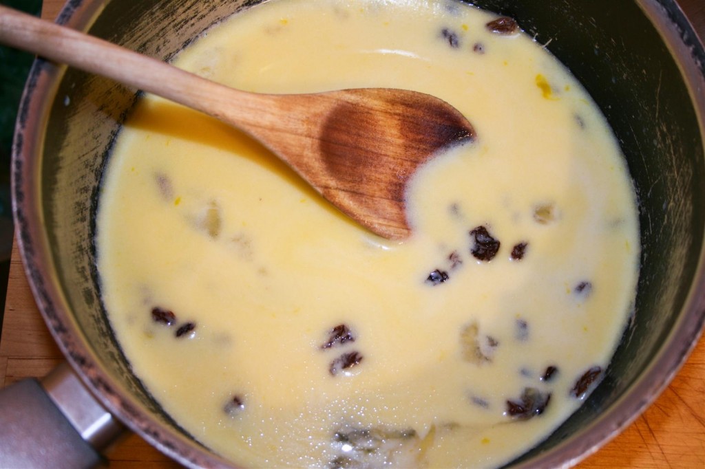 Mixing the raisins with the milk and butter
