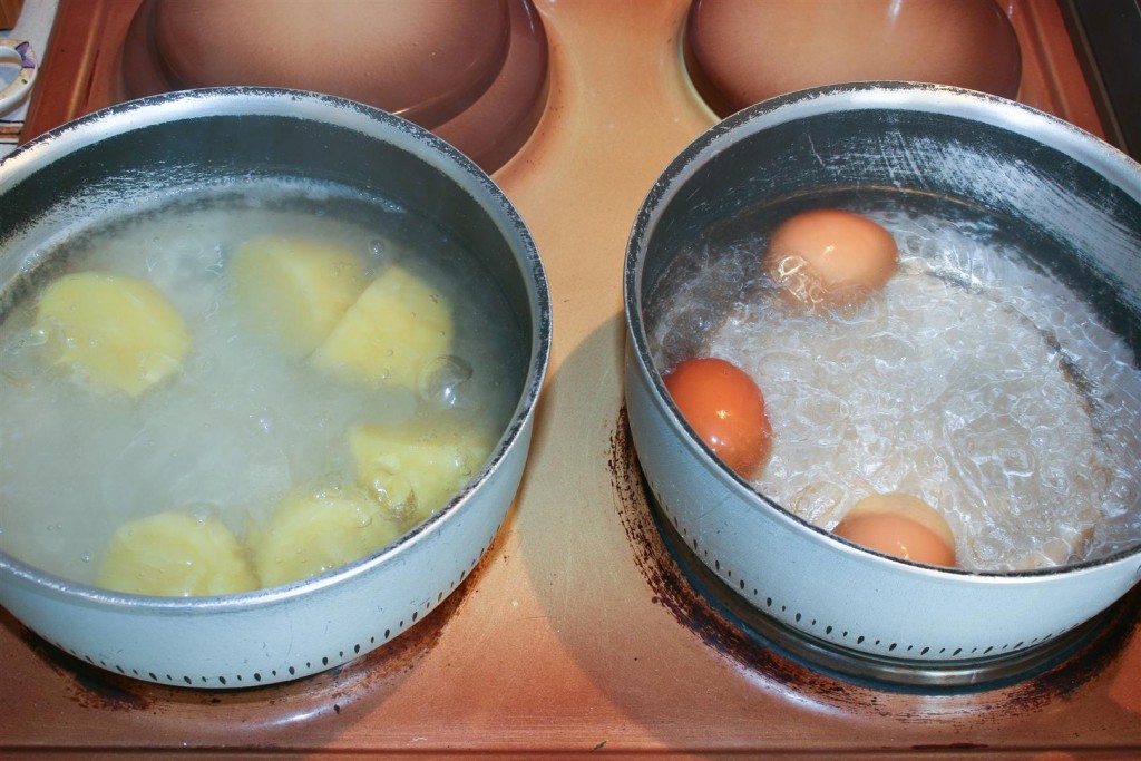 Boiling the egg and potatoes
