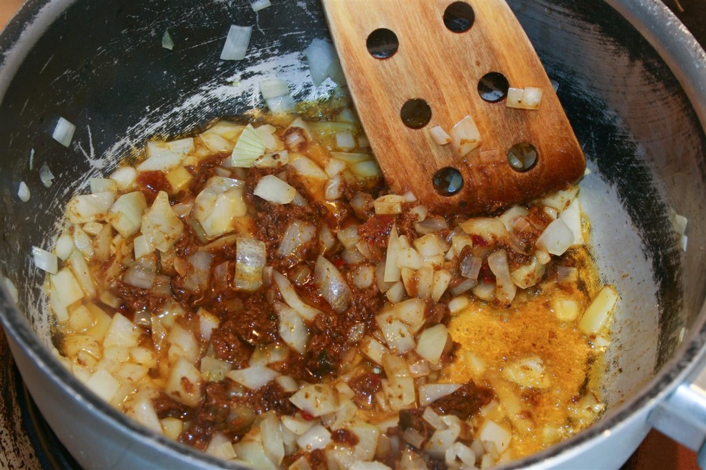 Frying the onion and curry paste