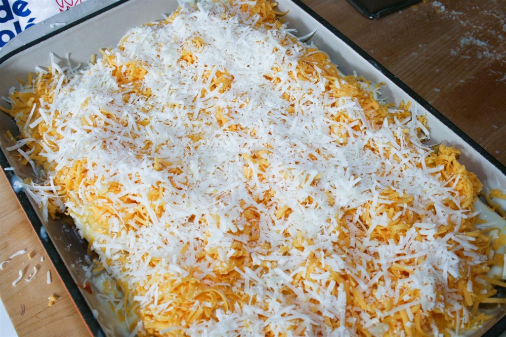 Topping with grated cheese